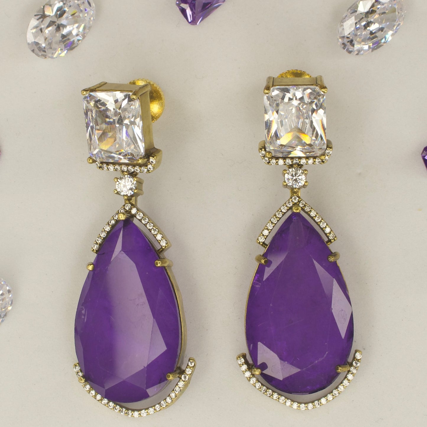 Fancy yet classic stone hanging earrings with victorian finish available in red, green, purple & mint