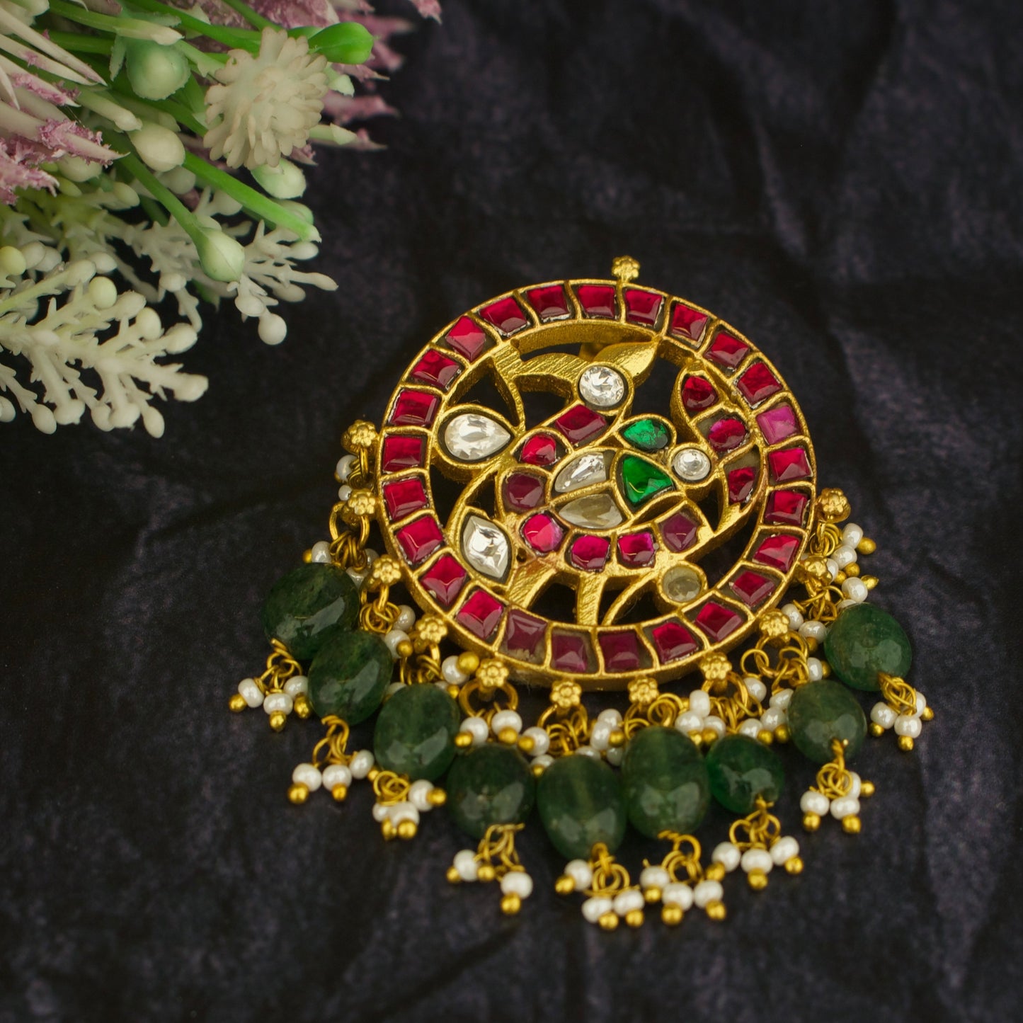 peacock design gold-tone jadau kundan locket with red stones and green beads