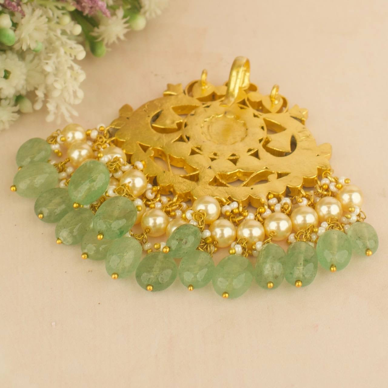 Floral jadau kundan locket pendant with pearl and green bead fringe