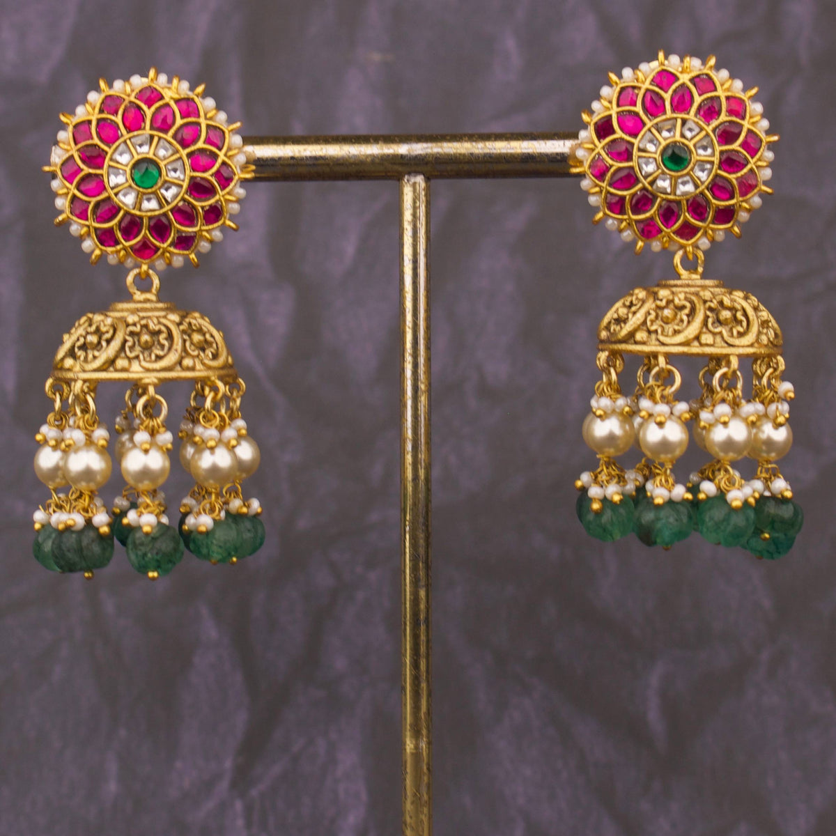 Side view of premium gold Temple Style Jadau Kundan Jhumki With Emerald Beads