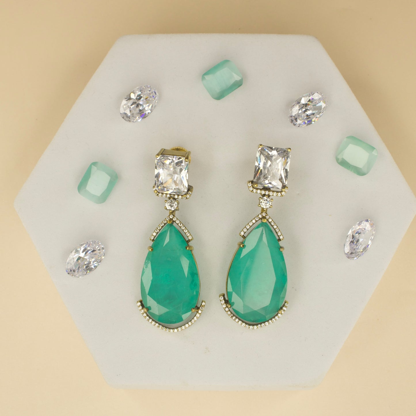 Fancy yet classic stone hanging earrings with victorian finish available in red, green, purple & mint