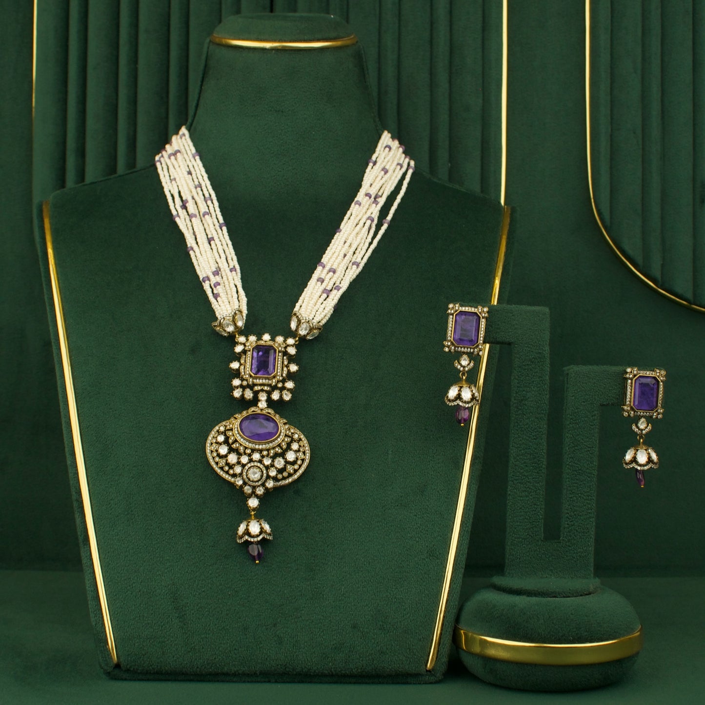 royal chandbali necklace and earrings set with purple stones and white beads