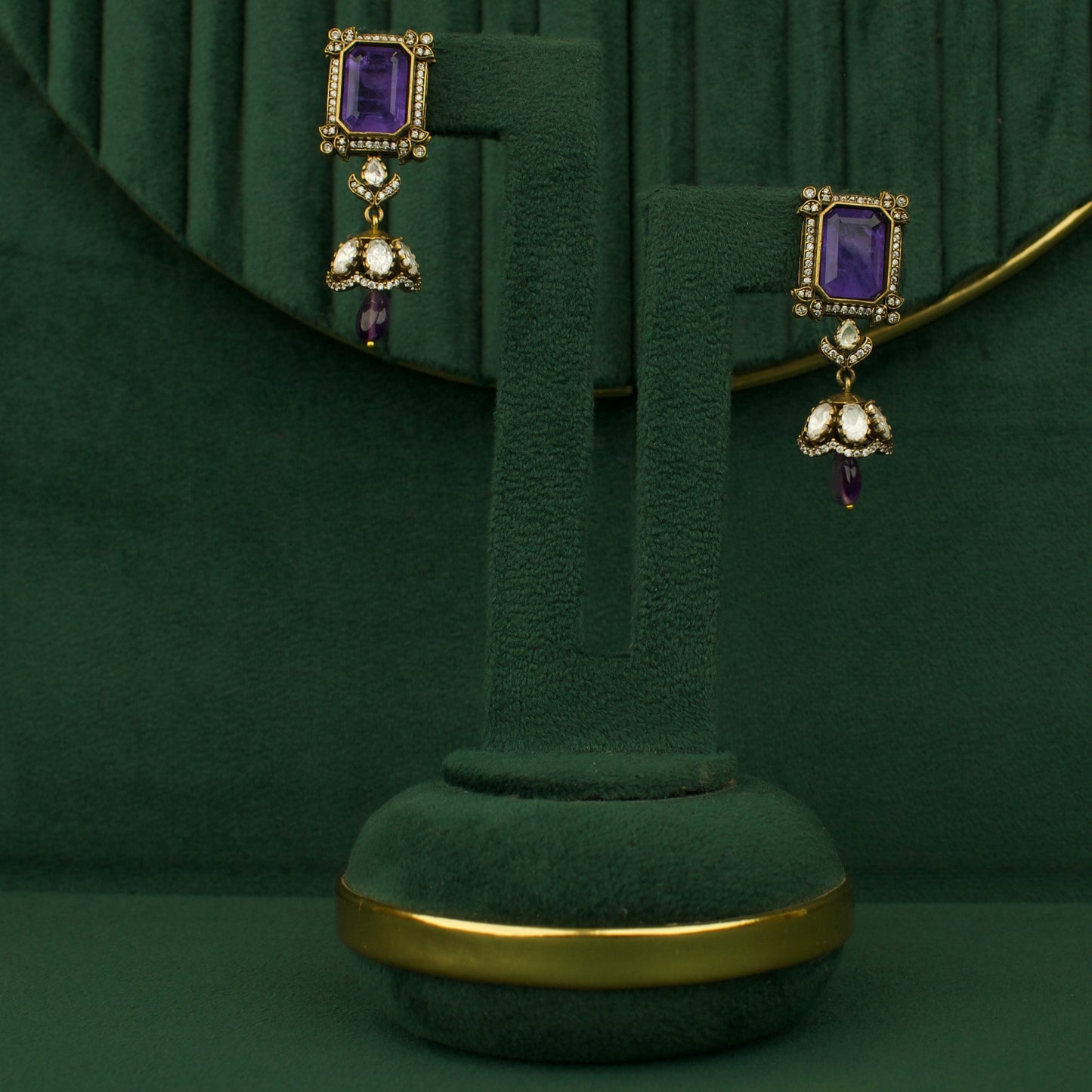 Chandbali earrings pair with purple stones and gold-tone bead drops