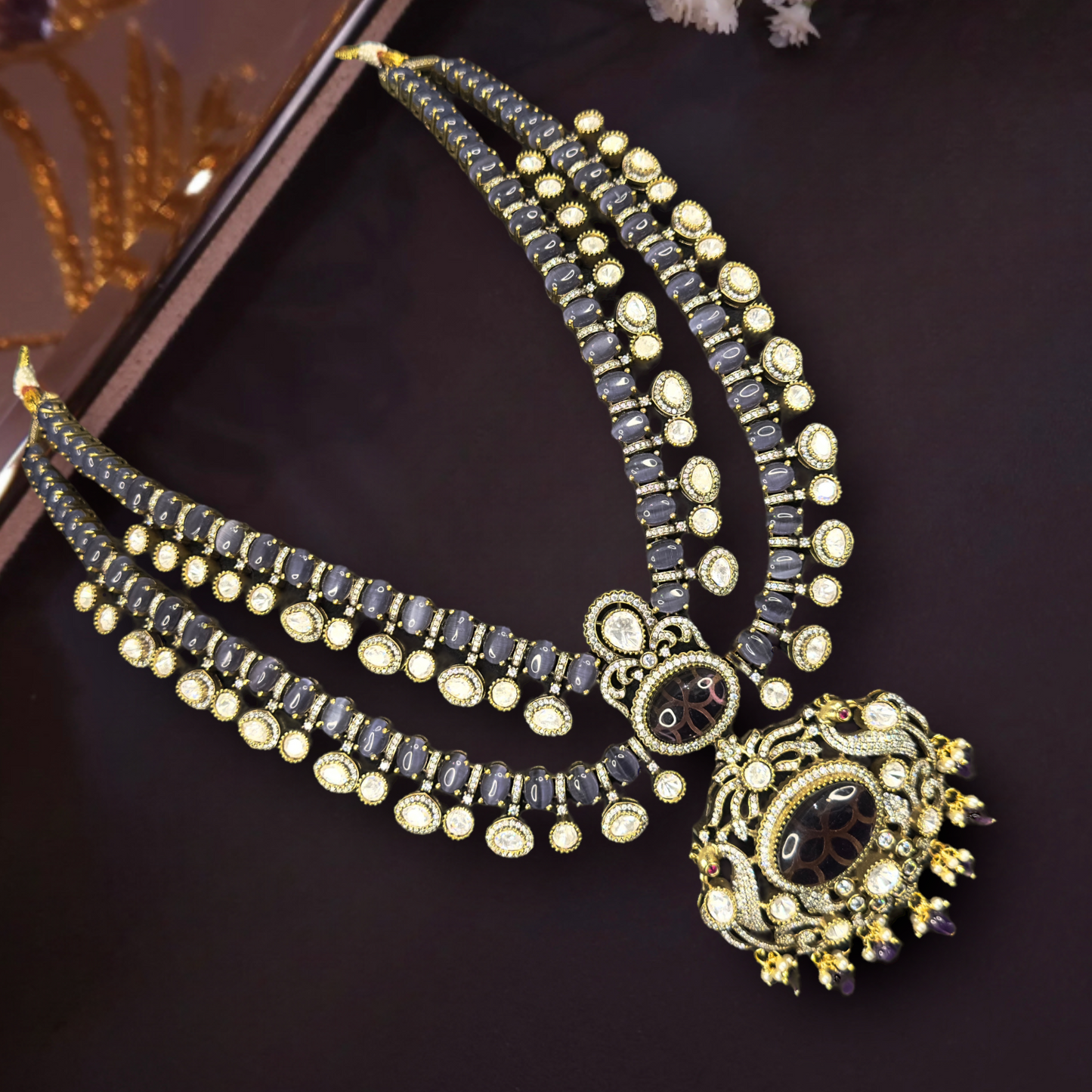 Multi-Layer Statement Victorian Necklace Set with zircon, moissanite polki stones, pearls, and beads, including matching earrings. This Victorian Jewellery is available in a Purple colour variant.