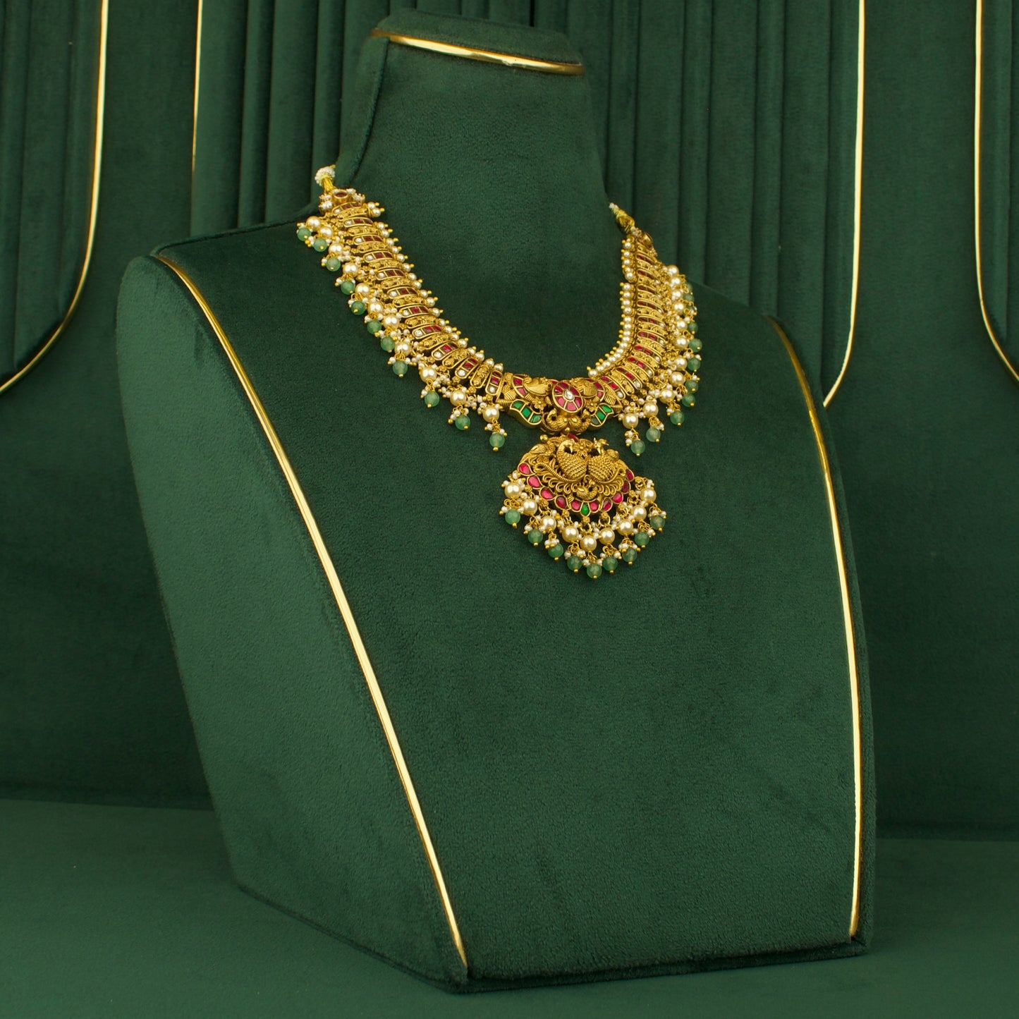 Chandbali necklace with peacock motif, pearl accents, green beads