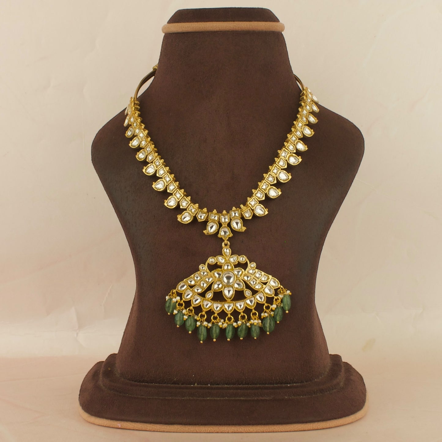 Dazzling Floral Design Locket Jadau Kundan Necklace with Green beads