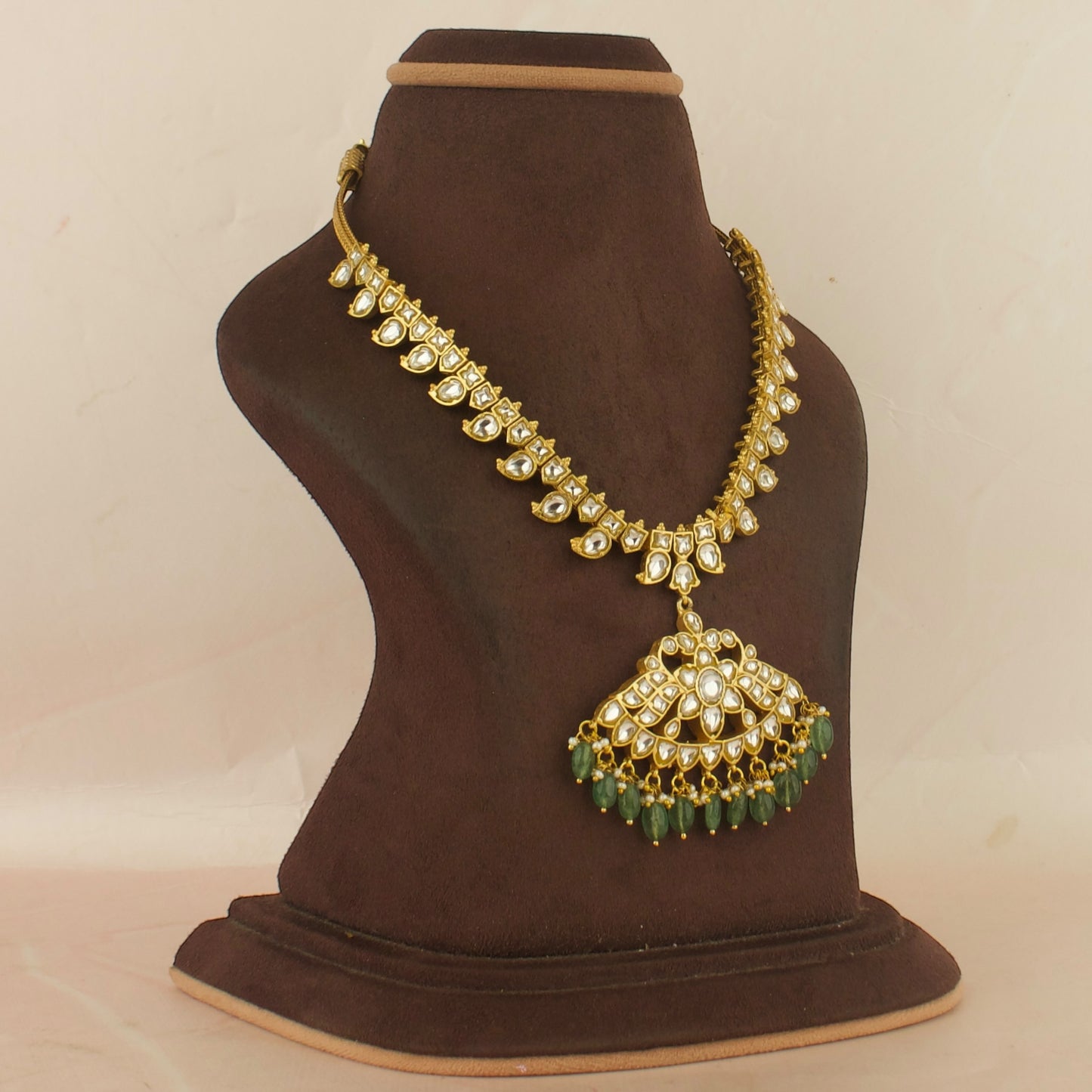 Dazzling Floral Design Locket Jadau Kundan Necklace with Green beads