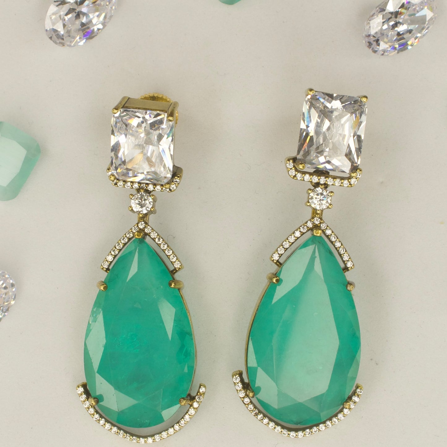 Fancy yet classic stone hanging earrings with victorian finish available in red, green, purple & mint