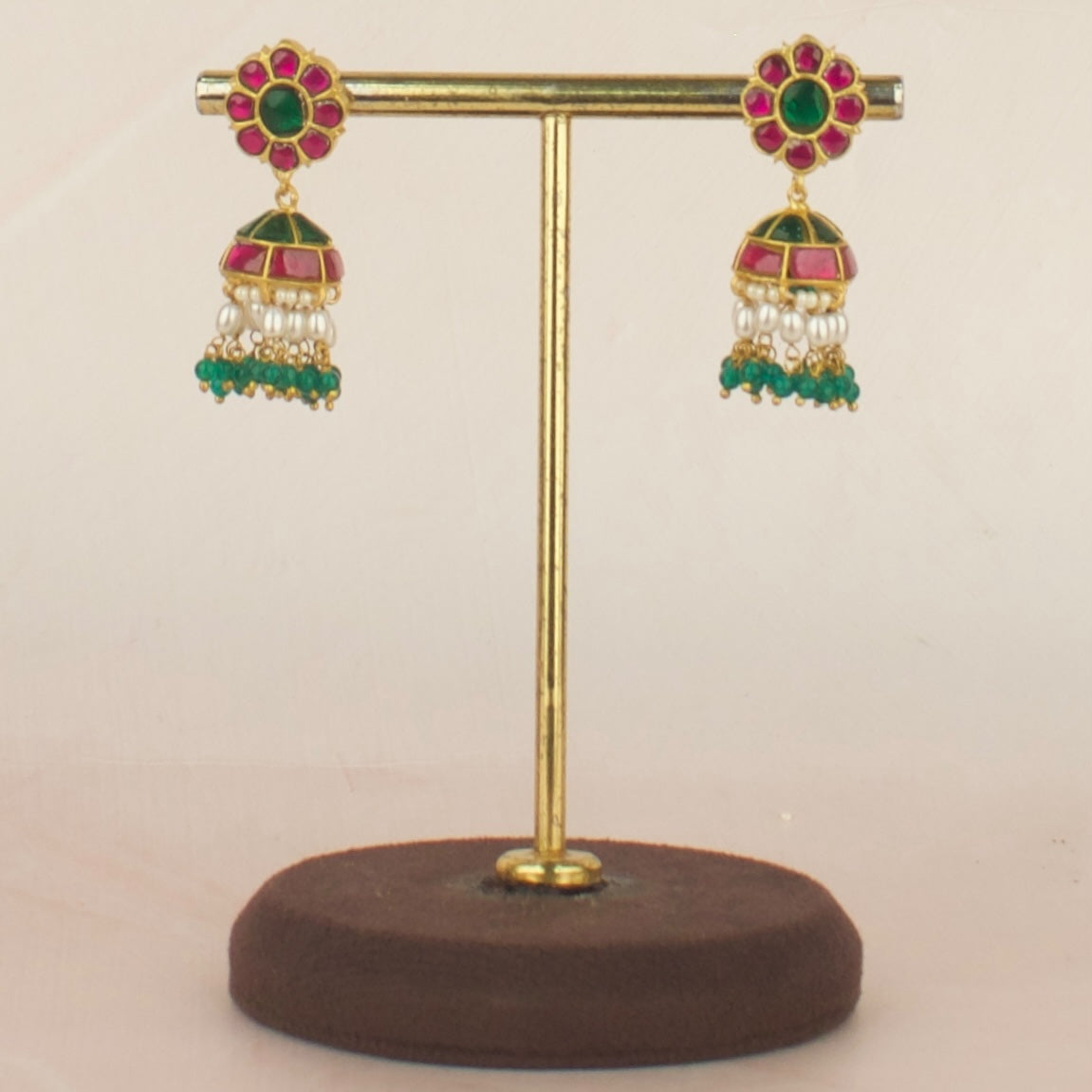 Unique floral design Jadau Kundan Jhumki with Ricepearl and Green Bead as Hanging, elegantly displayed for sale.