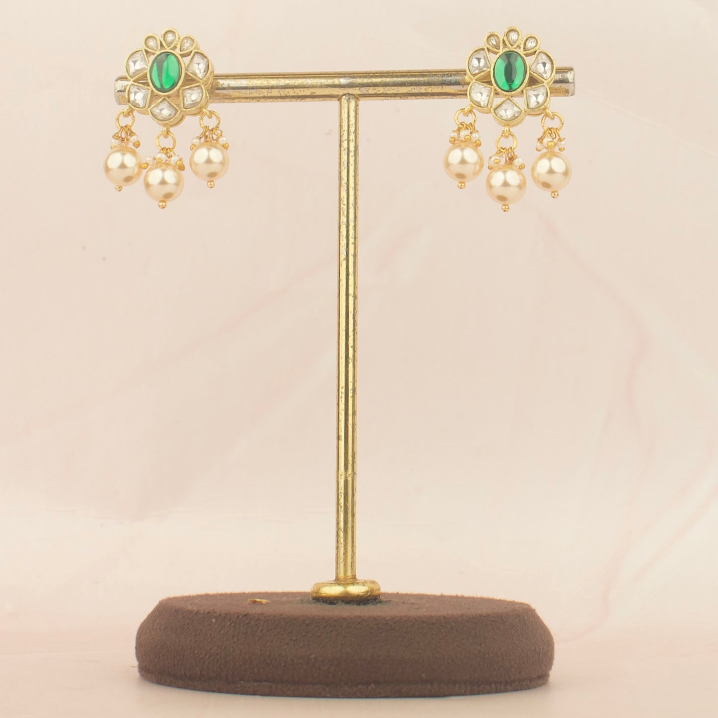 Pair of jadau kundan Nantad style earrings with green stones and pearl drops