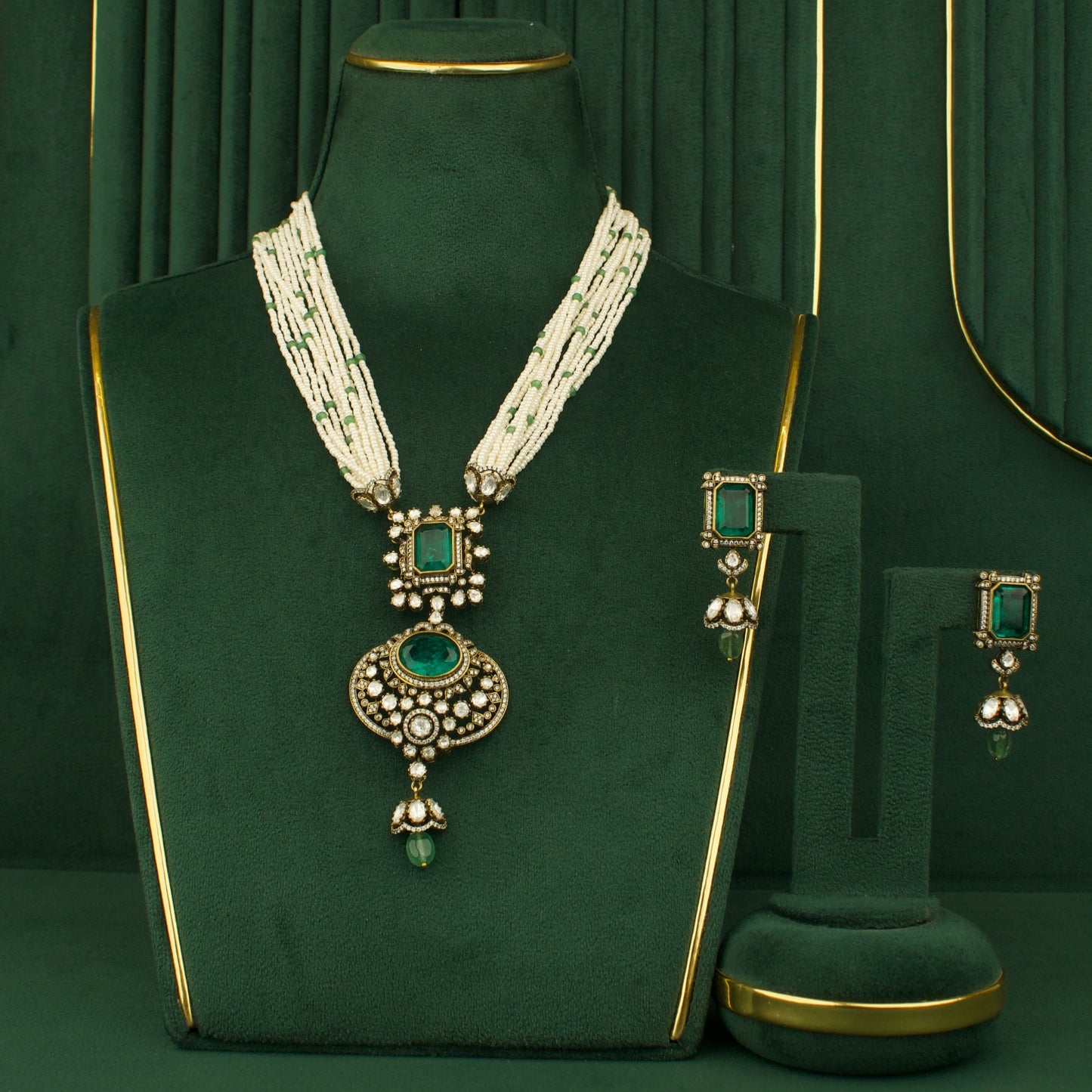2-piece necklace and earrings set with emerald stones and white bead strands