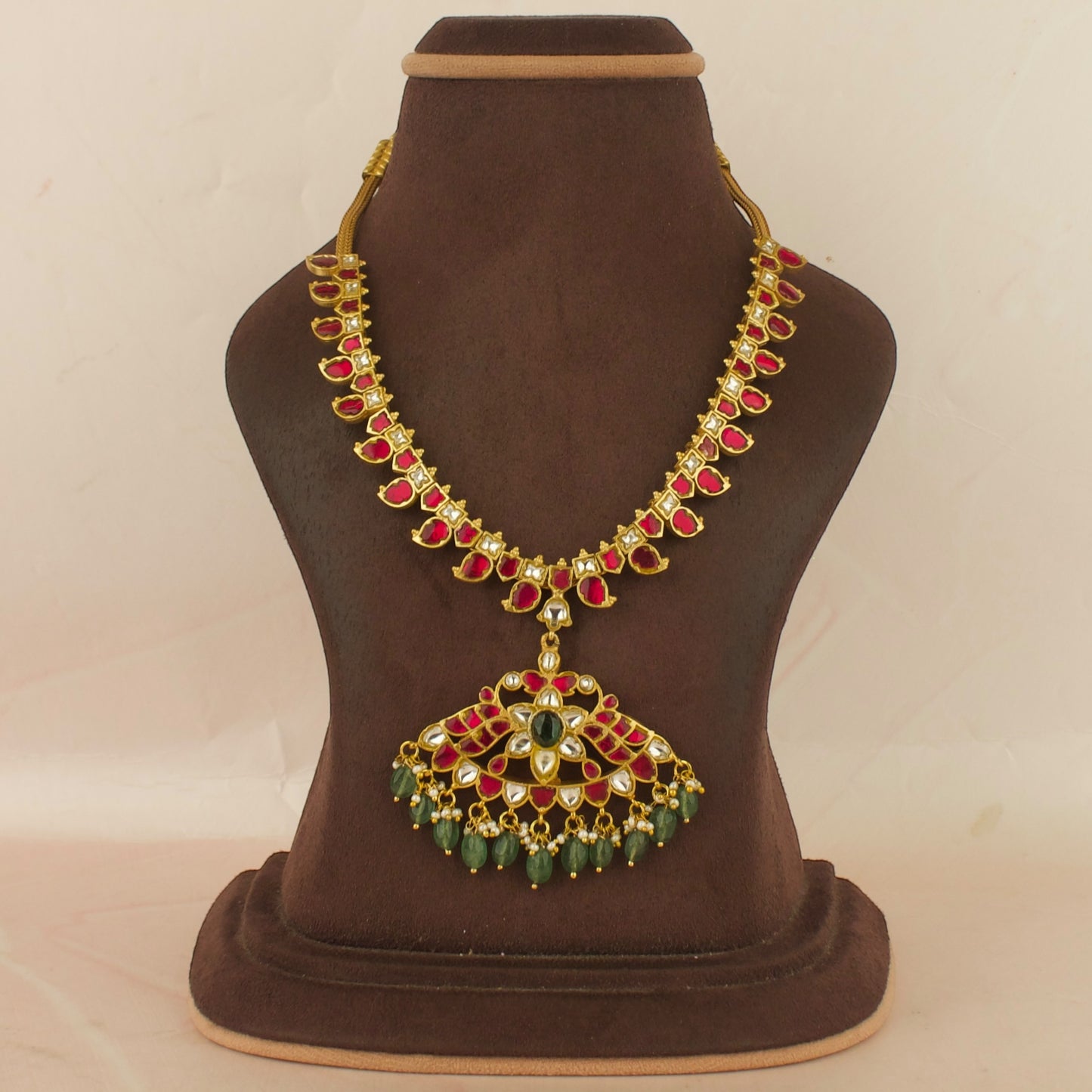 Dazzling Floral Design Locket Jadau Kundan Necklace with Green beads