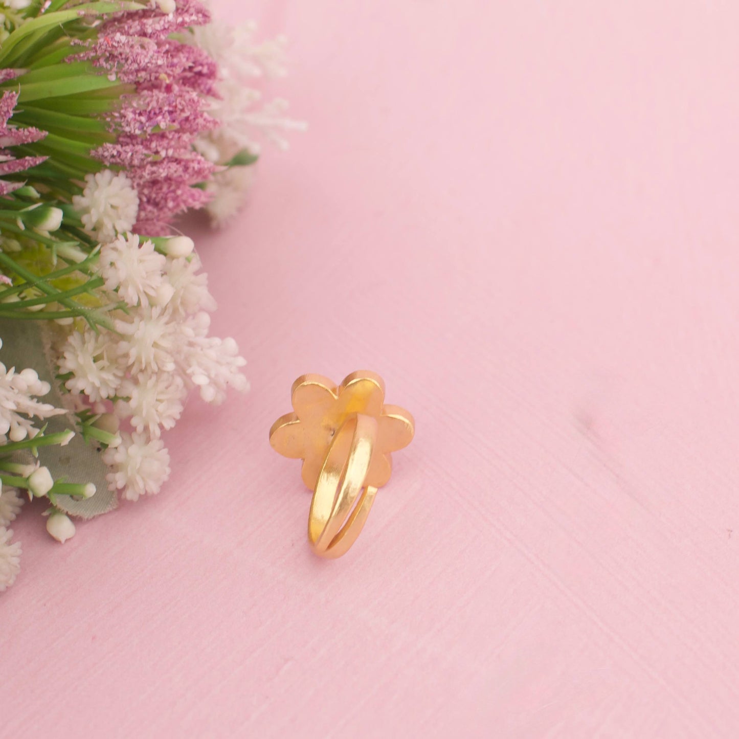 Floral Jadau Kundan Ring With Kundan Highlights And Emerald Center