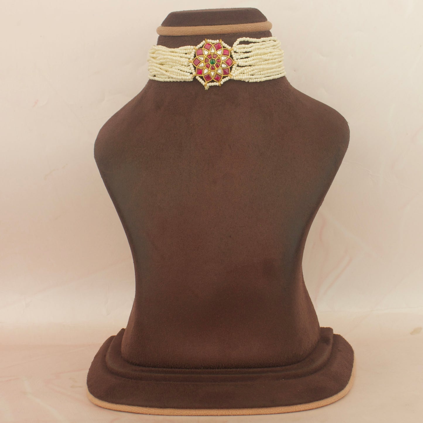 Sleek jadau kundan pearl choker with floral center locket