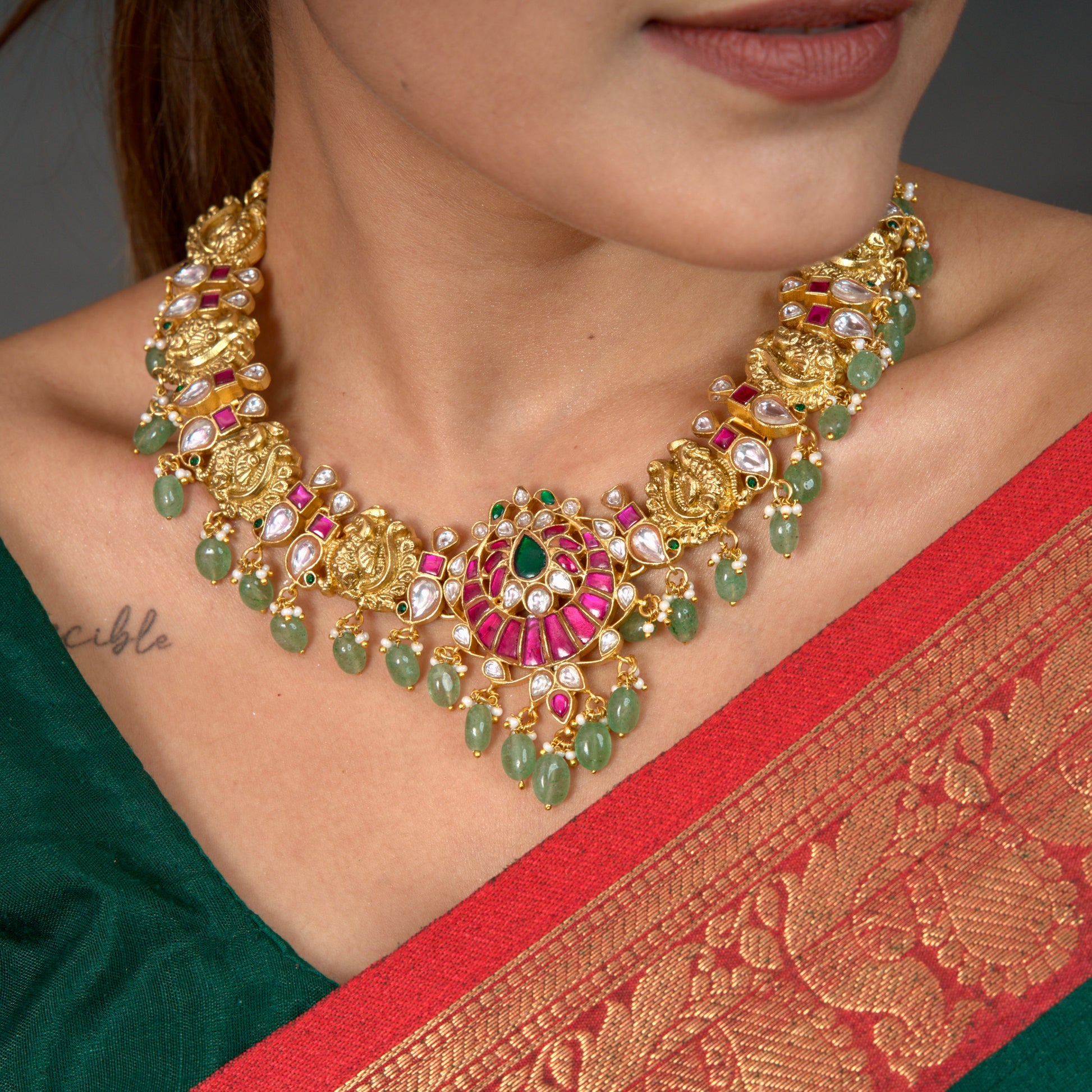 Elegant Floral Motif Jadau Kundan Necklace with Green Beads with 22k gold platingThis Product Belongs to Jadau Kundan Jewellery Category