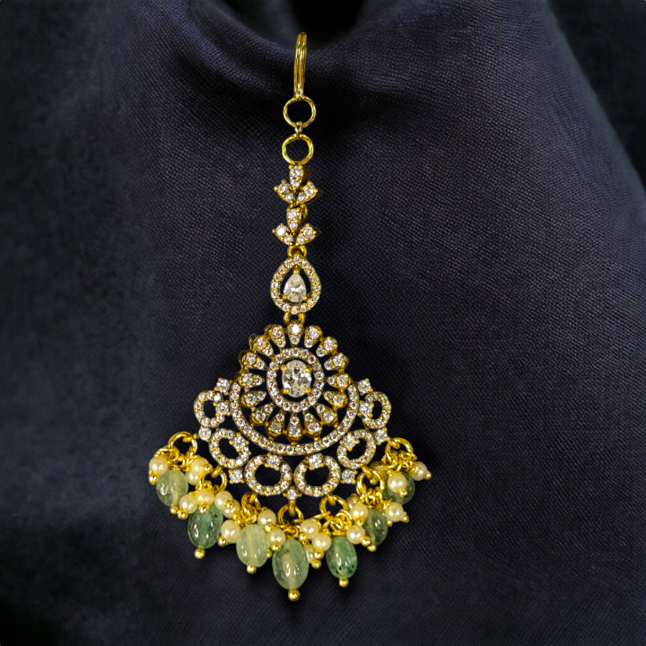 Zircon Embellished Victorian Maang Tikka. This Victorian Jewellery is available in a White colour variant. 