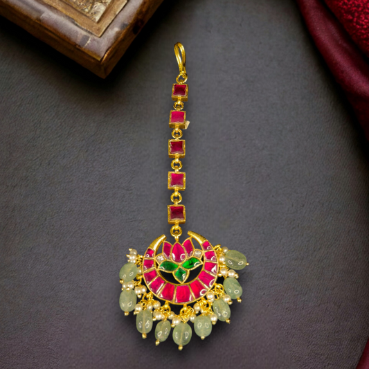 Lotus Chandbali Design Jadau Kundan Maangtika in 22k gold plating. this product comes under jadau kundan collection