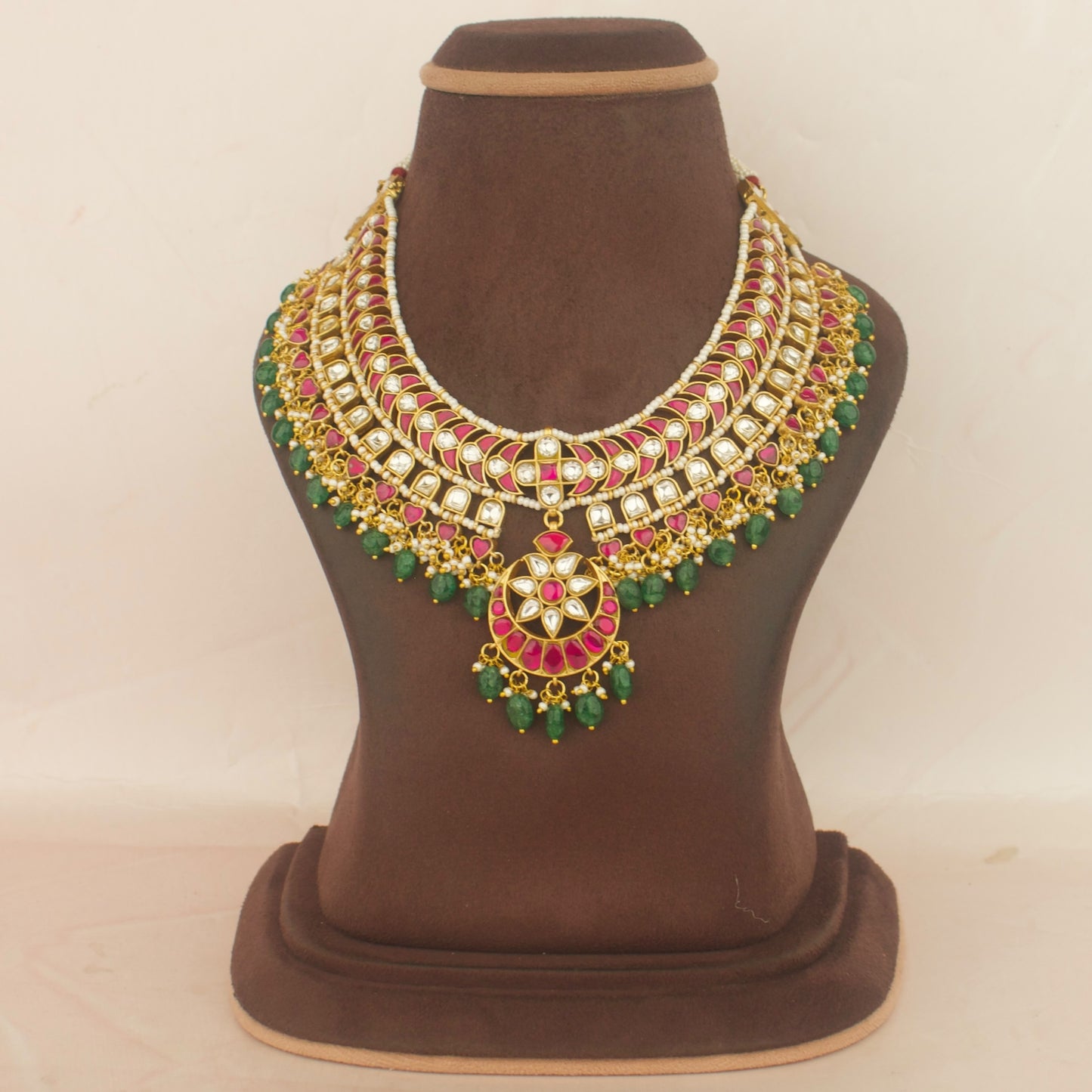 bridal layered jadau kundan necklace with red, white and green stones