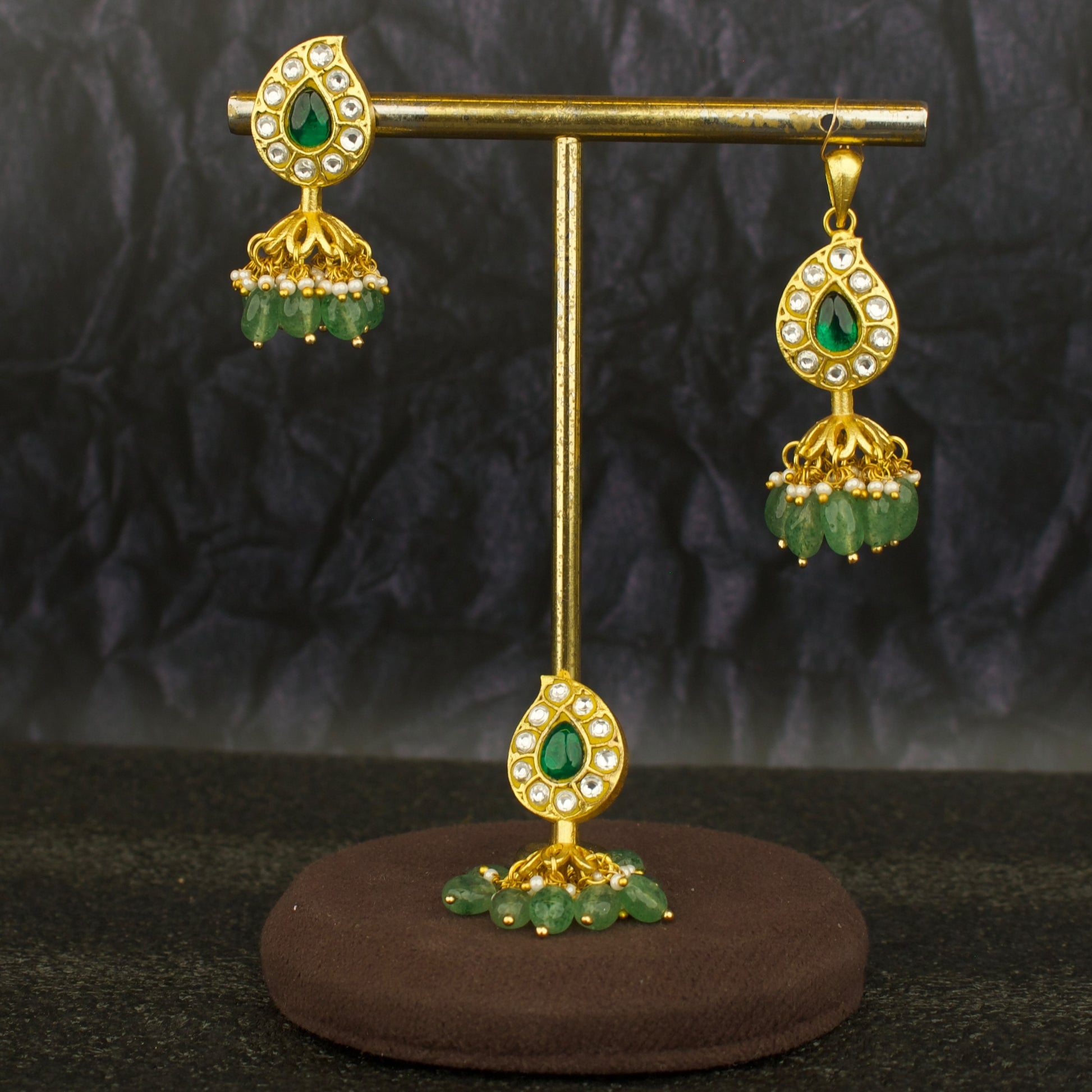 mango design jadau kundan pendant set three piece with green stones