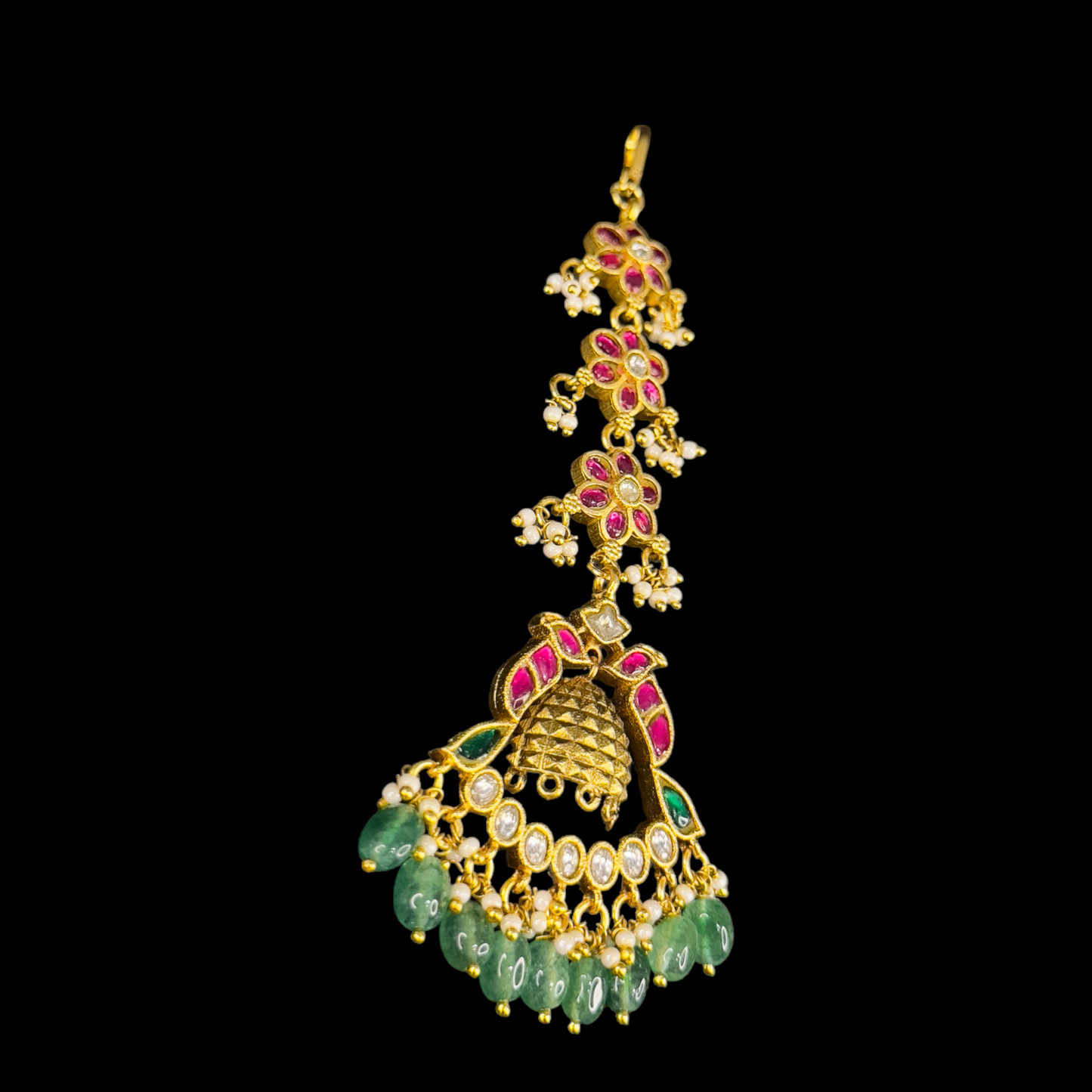 Floral Elegance Jadau Kundan Maang Tikka with Intricate Detailing and Emerald Drops with 22k gold plating This product belongs to Jadau Kundan jewellery category