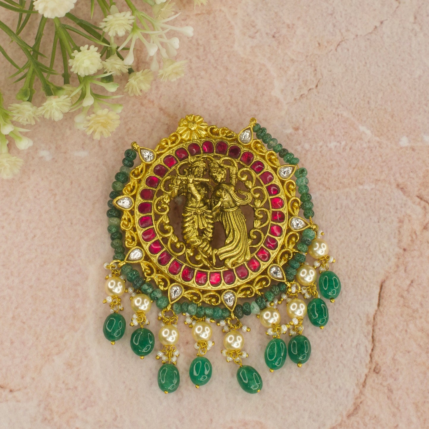 Here is Jadau Kundan Pendant with Nakshi Radha Krishna motifs. At bottom of the pendant we have Swarovski pearls and Russian emeralds, it is 22k gold plated