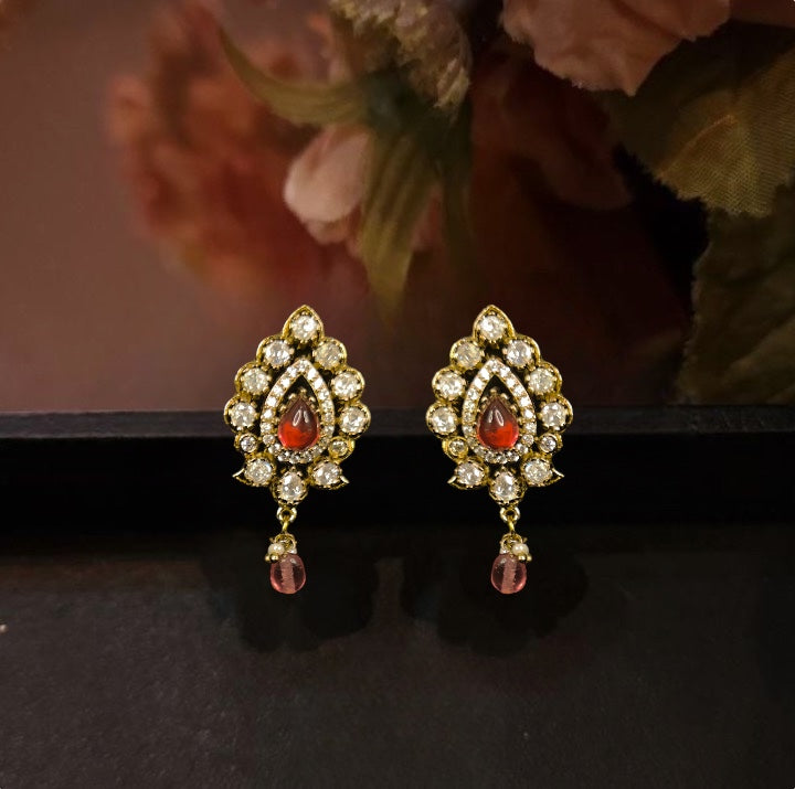 Leaf Design Victorian Moissanite Stud earrings with bead drops. This Victorian Jewellery is available in Red,White & Purple colour variants. 