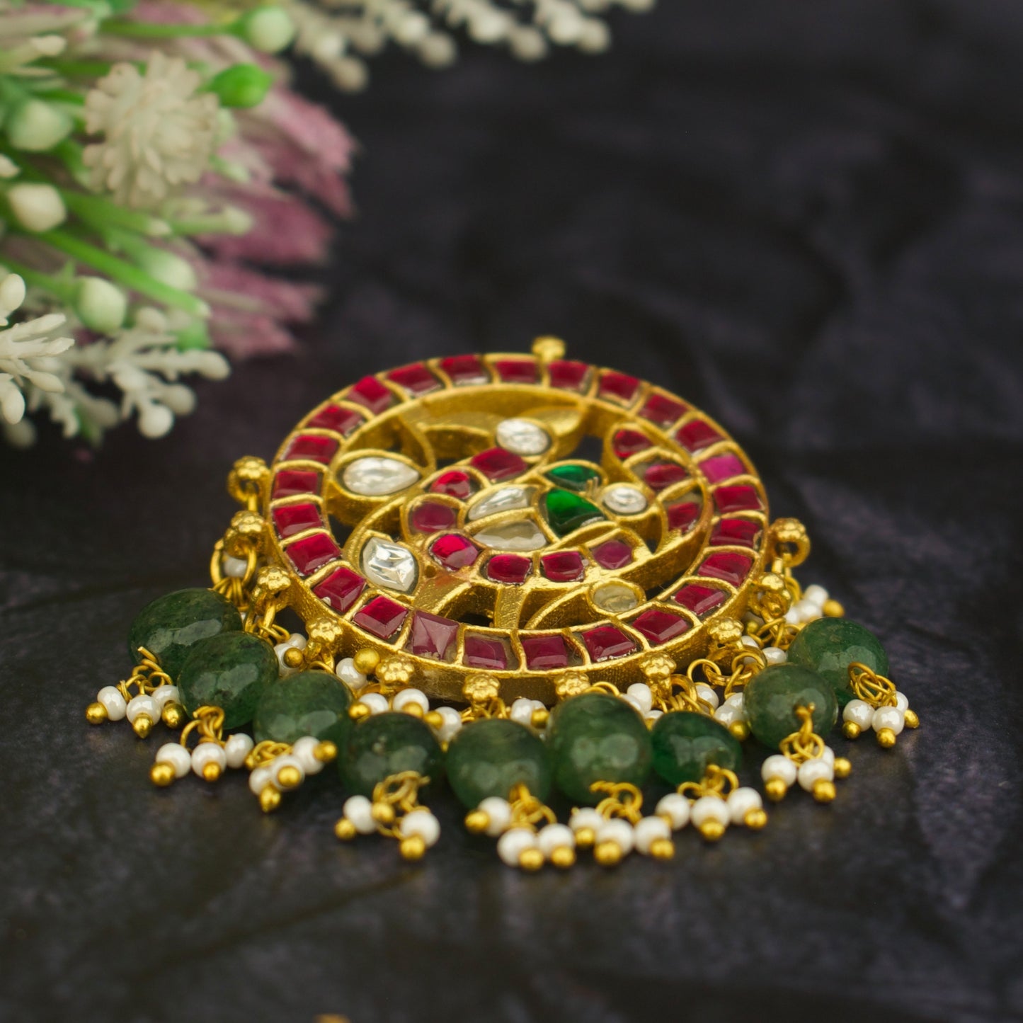 jadau kundan locket peacock design, gold tone with red stones and green beads