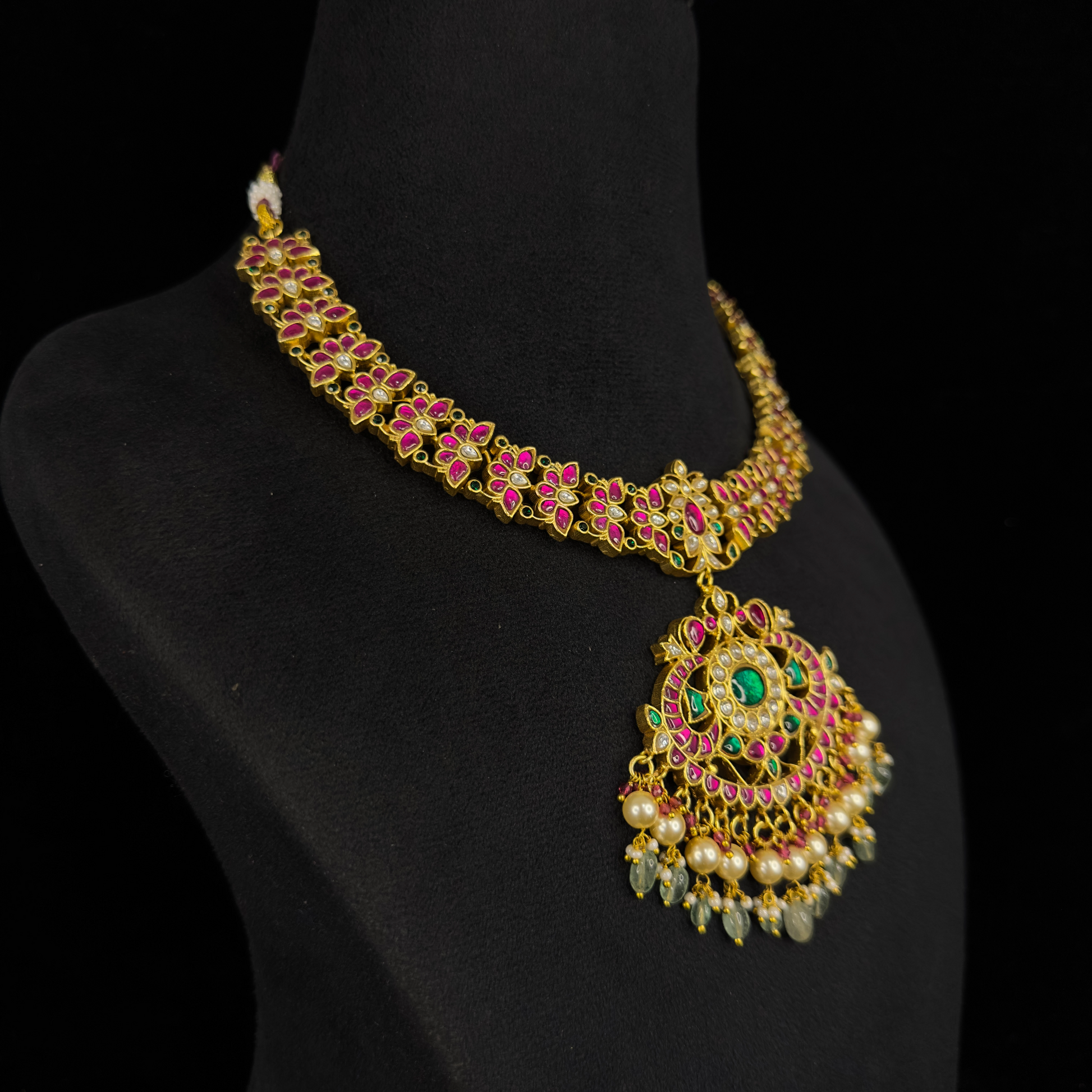 Ornate Splendor: Exquisite Jadau Kundan Necklace with Pearl Adornments with 22k gold plating This product belongs to jadau kundan jewellery category