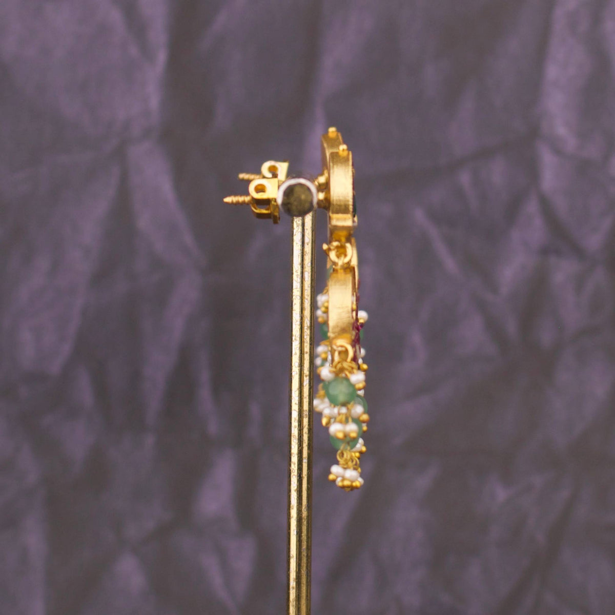 Side view of premium gold Exquisite Jadau Kundan Chandbali With Pearl And Green Bead Drops