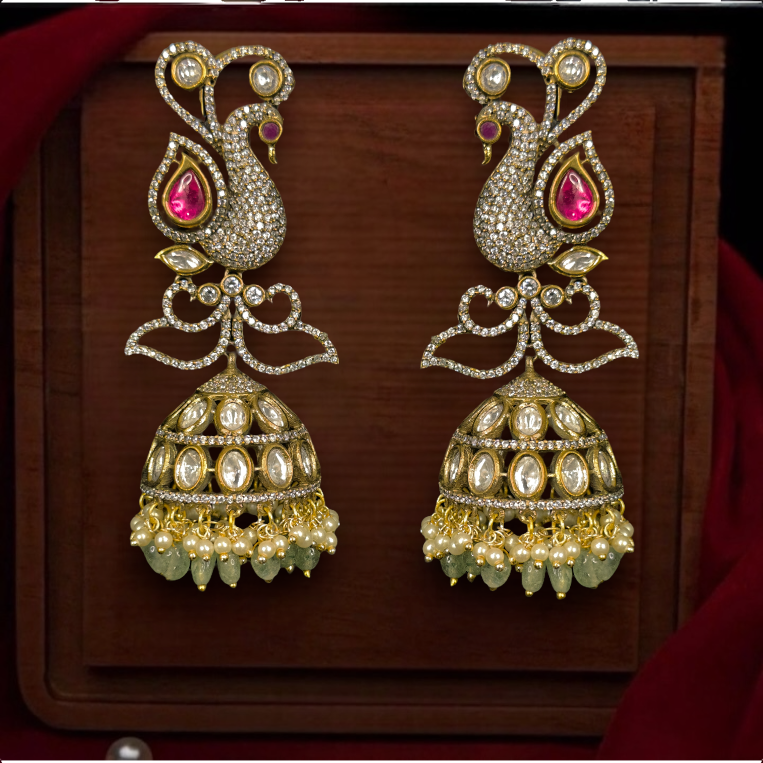 Victorian Peacock Jhumka with kundan polki stones. This Victorian Jewellery Is available in Pink & Green colour varaiants. 