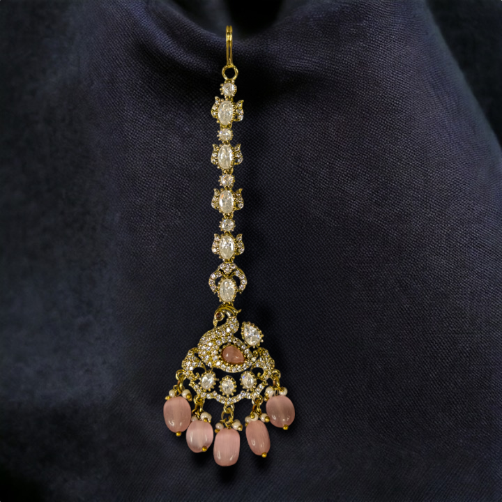 Ornate Victorian Maang Tikka with peacock motifs & onyx beads. This Victorian Jewellery is available in a Pink colour variant. 