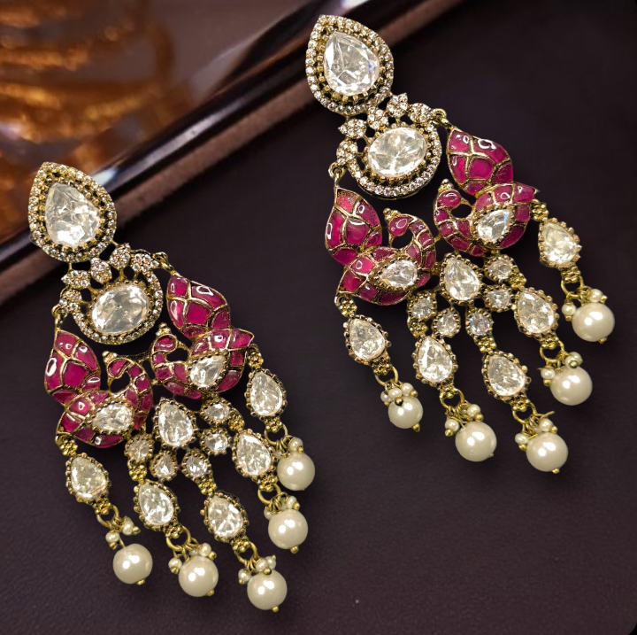 Timeless Victorian x Jadau Earrings with freshwater pearls with kundan & zircon stones, moissanite polki, and fresh water pearls at the bottom. This Victorian Jewellery Is available in Red & Green colour varaiants. 