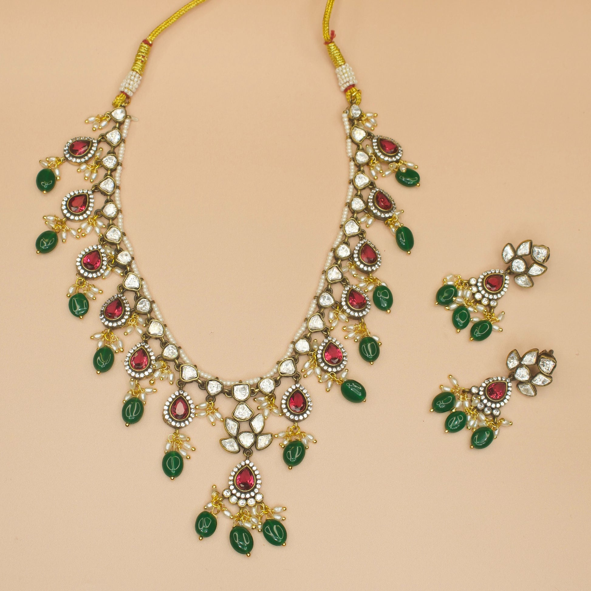 One-Line Victorian Moissanite Necklace Set with earrings. This Victorian Jewellery is available in Red,Green & Purple colour variants. 