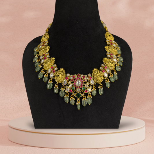 Elegant Floral Motif Jadau Kundan Necklace with Green Bead Drops with 22k gold platingThis Product Belongs to Jadau Kundan Jewellery Category