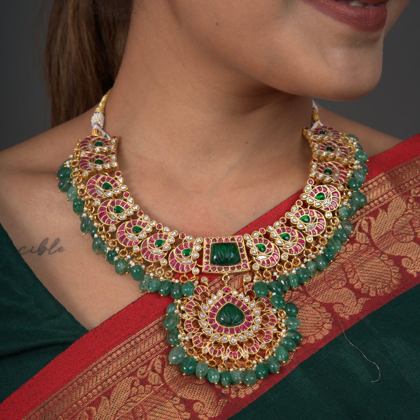 Elegant Jadau Kundan Necklace with Emerald Bead Accents with 22k gold plating This product belongs to Jadau Kundan jewellery category 