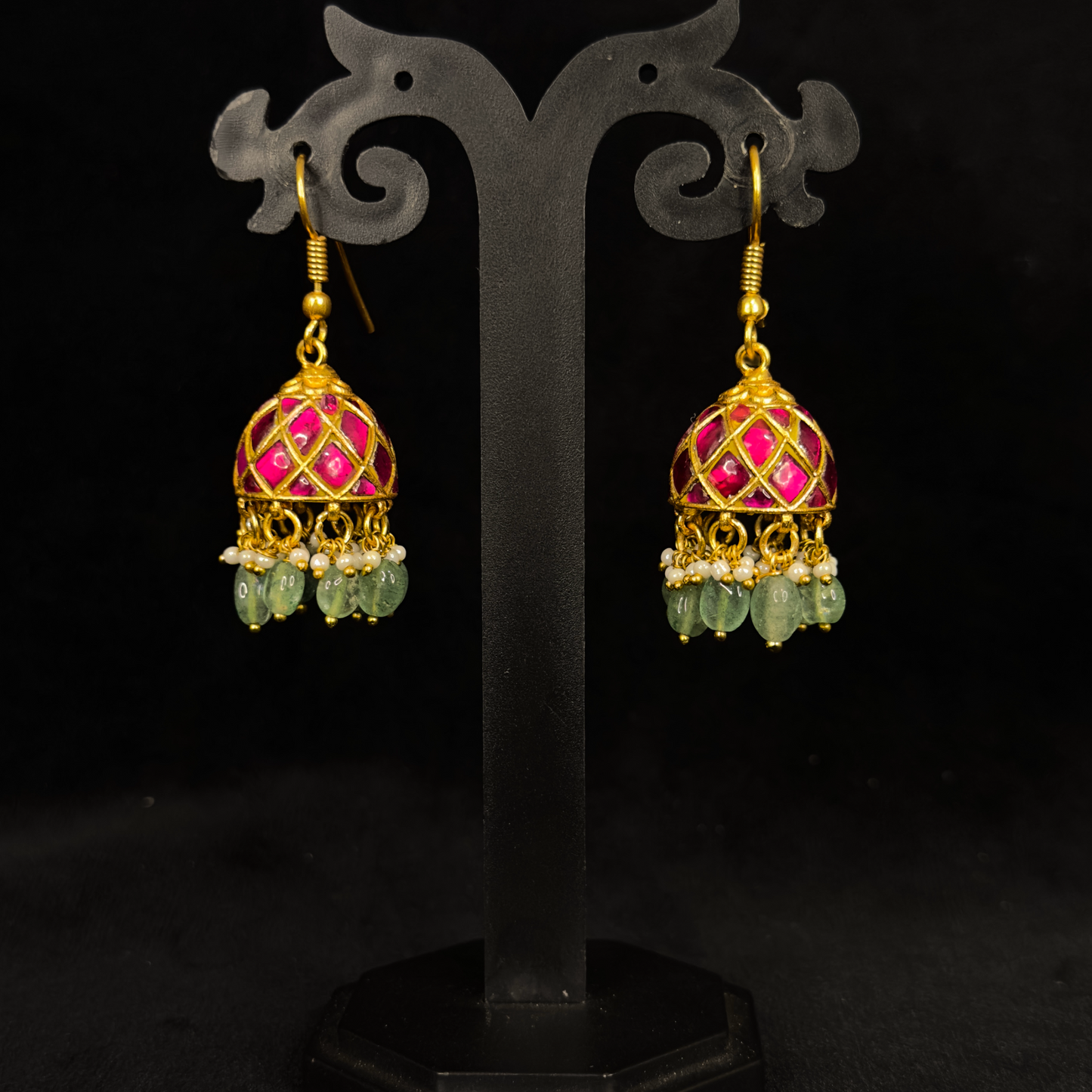 Exquisite Handcrafted Jadau Kundan Jhumka Earrings with Emerald Beads with 22k gold plating. This product belongs to jadau kundan jewellery category