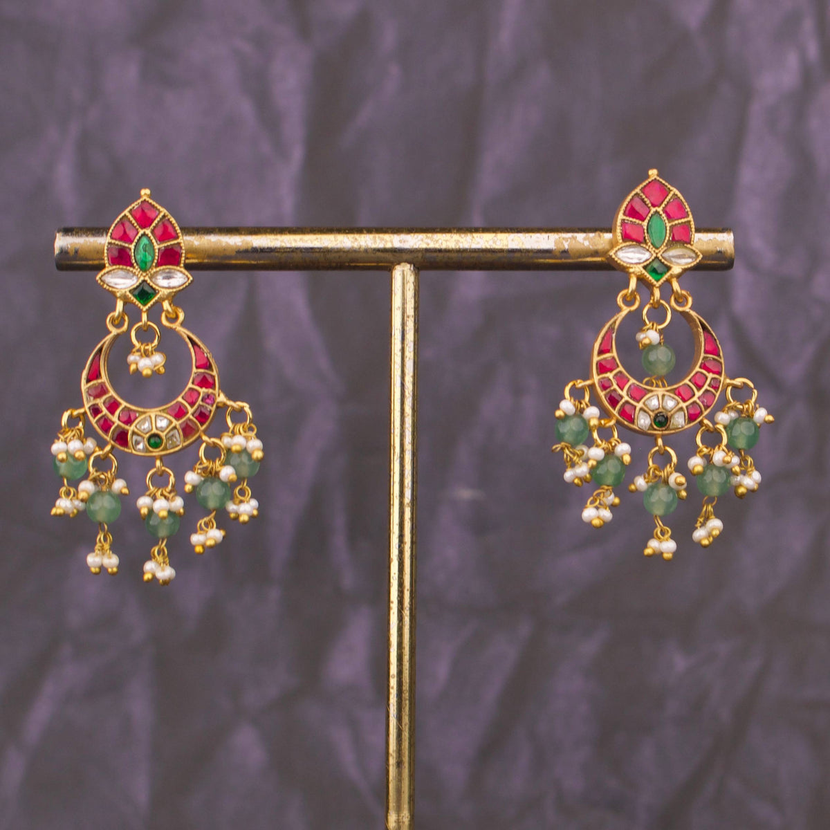 Premium gold Exquisite Jadau Kundan Chandbali With Pearl And Green Bead Drops adorned with ruby