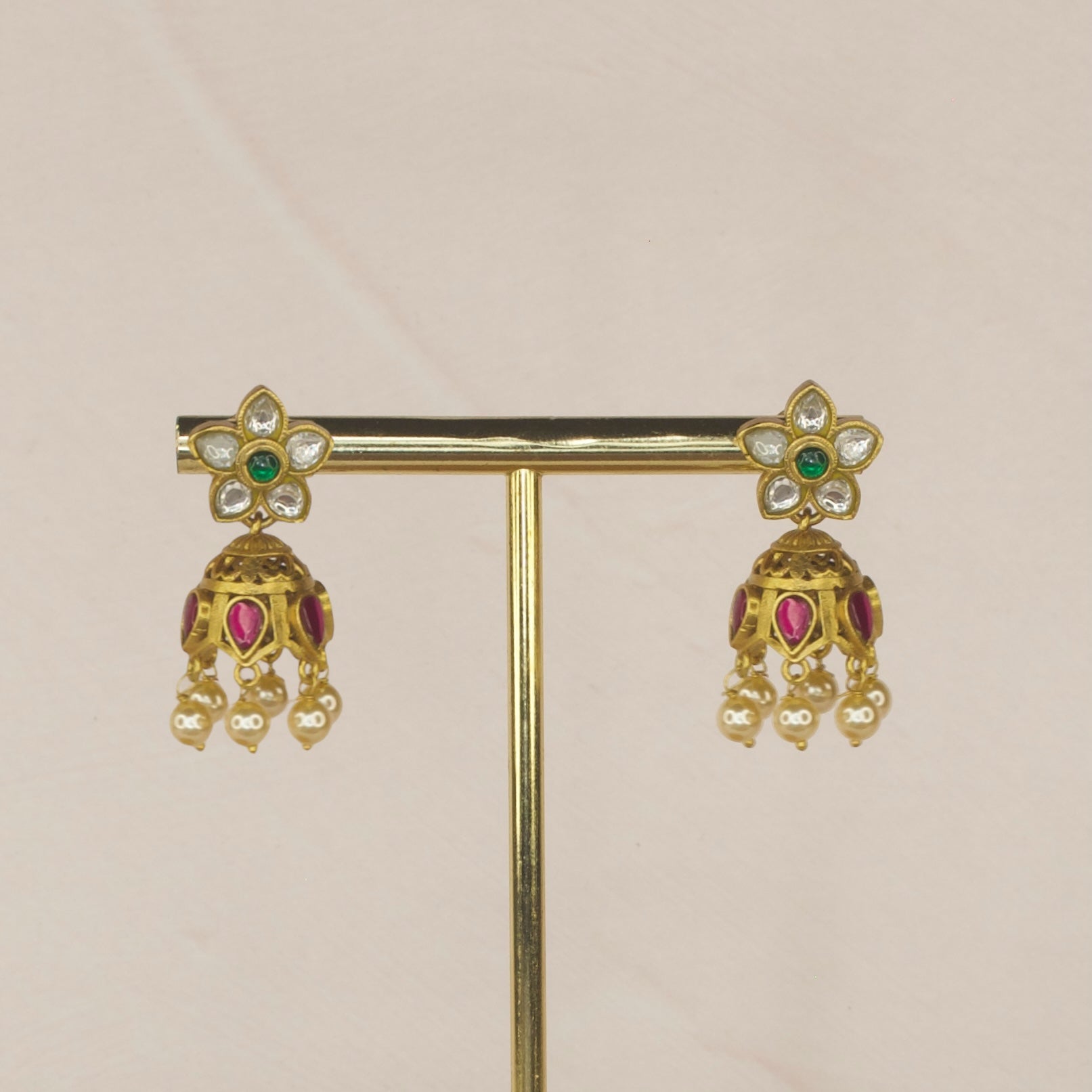 Petite Blossom Jadau Kundan Jhumkas with Pearl Accents with 22k gold plating. This product belongs to jadau Kundan jewellery category