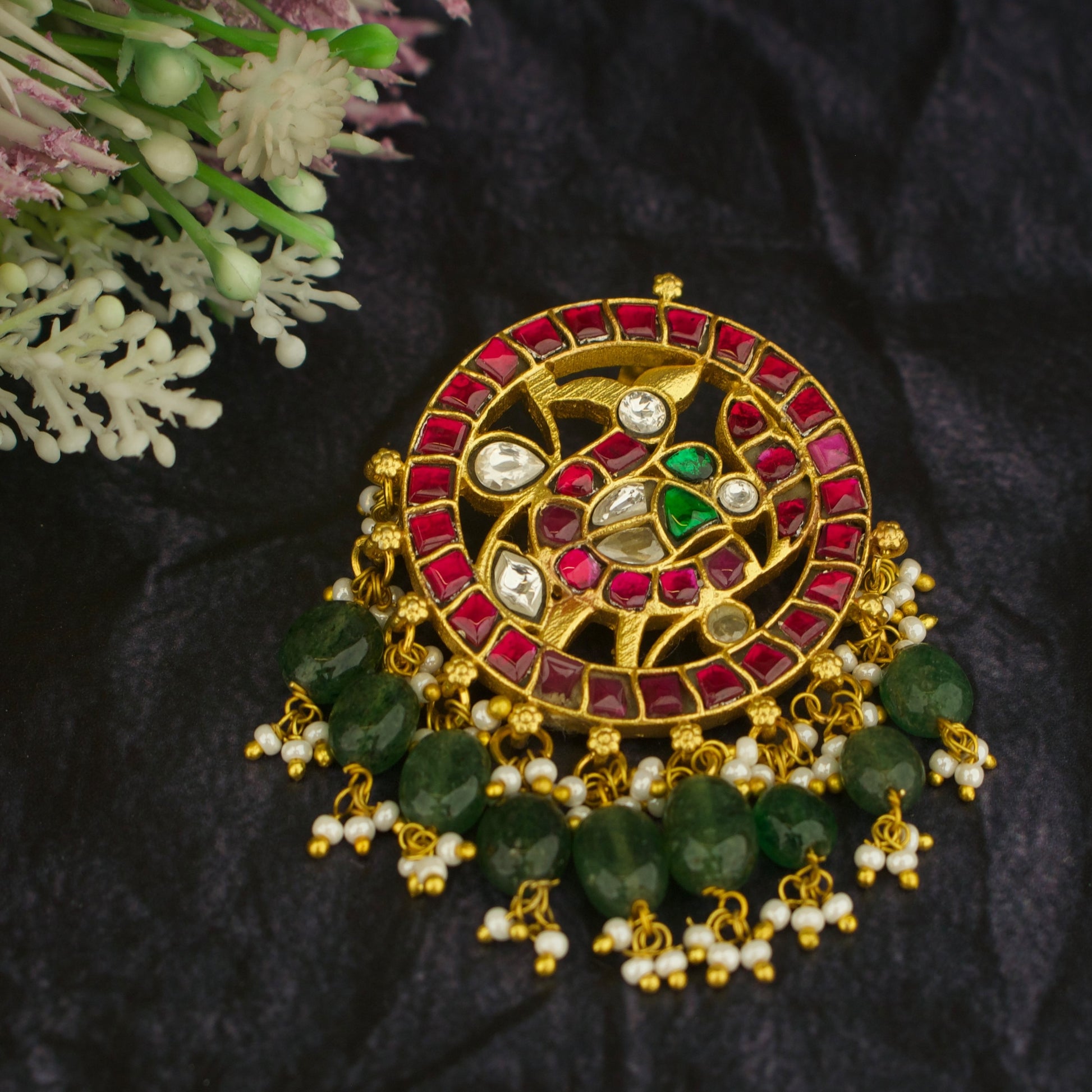 peacock design gold-tone jadau kundan locket with red stones and green beads