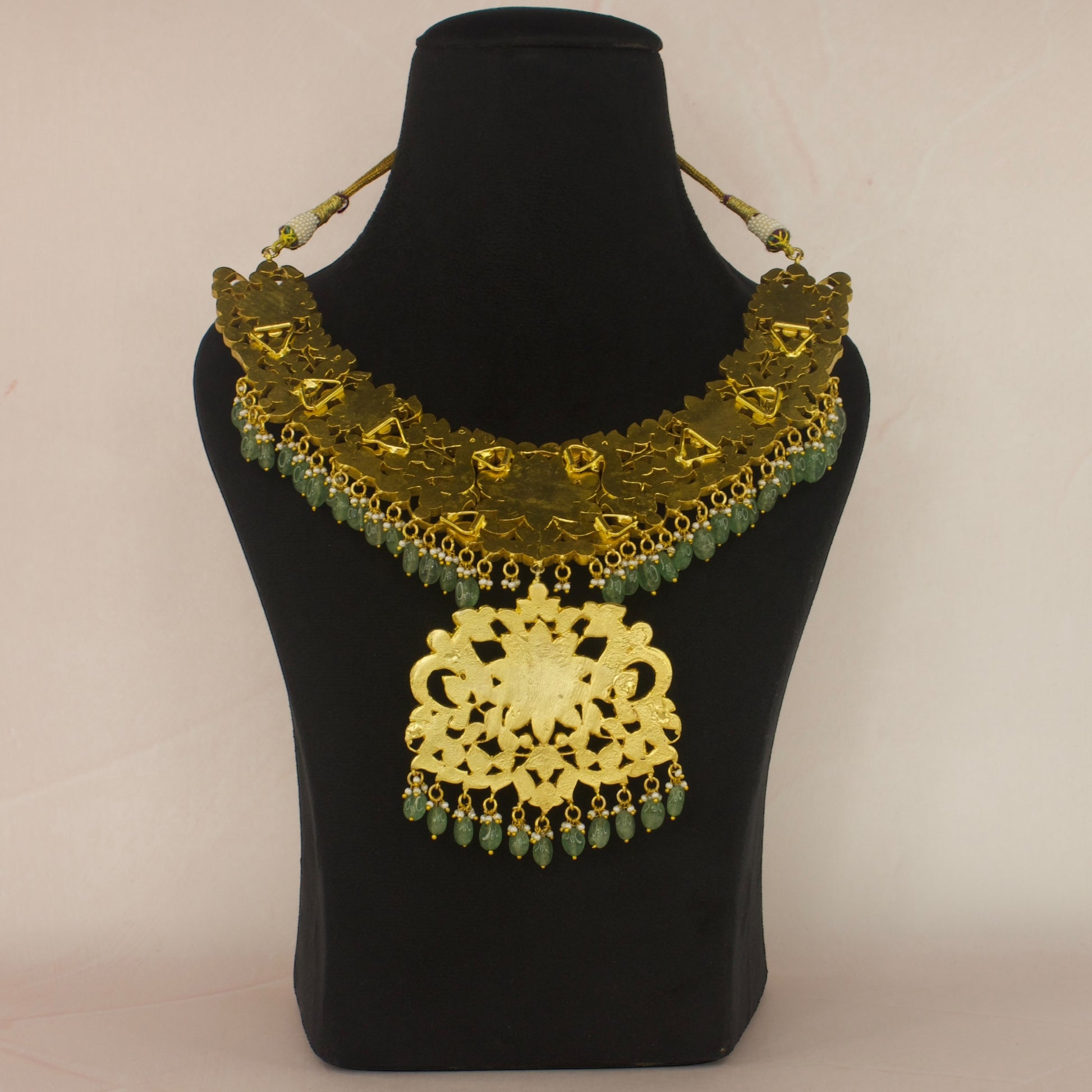 Regal Peacocks Jadau Kundan Necklace with Emerald and Ruby Accents with 22k gold plating This product belongs to Jadau Kundan jewellery category
