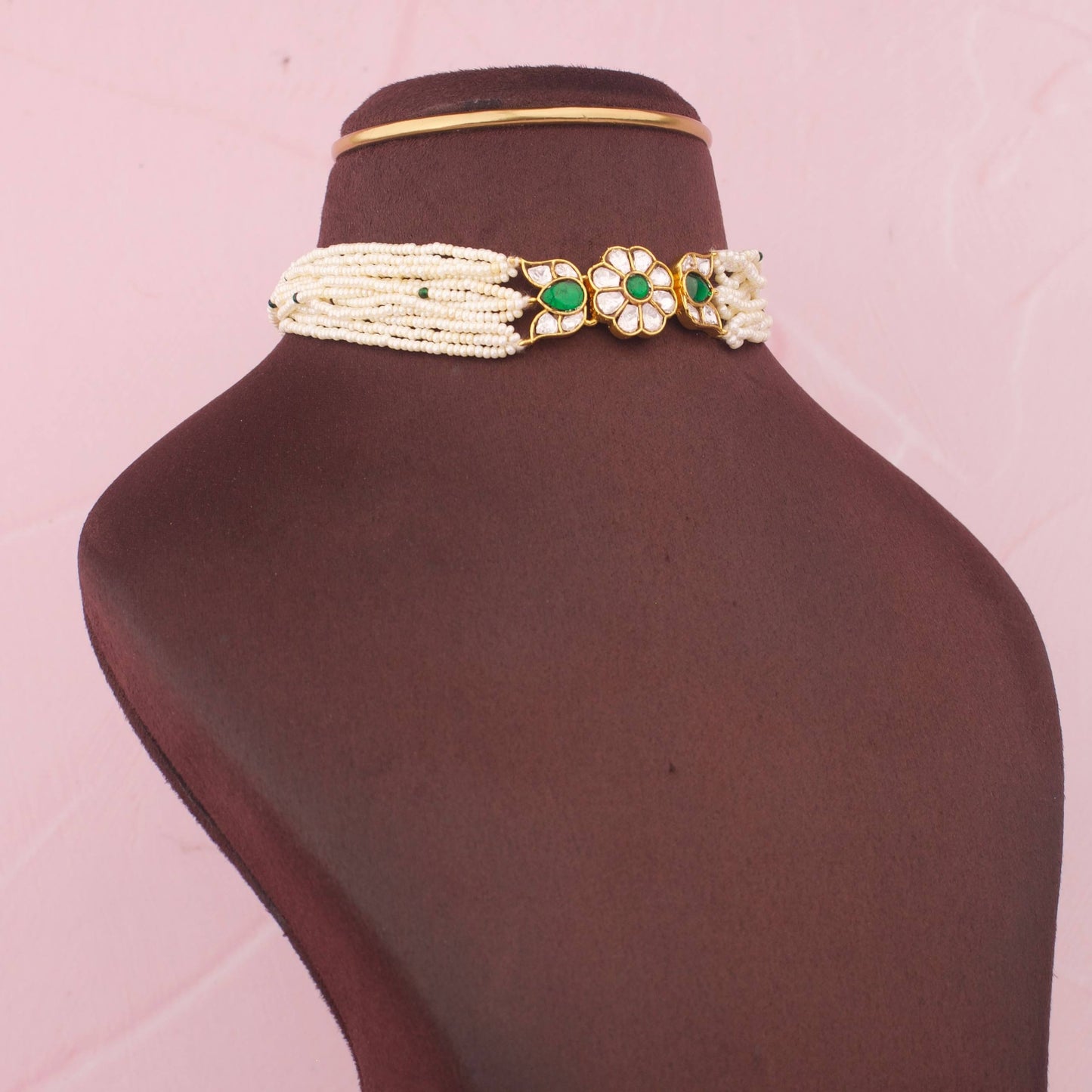 Multi-Strand Pearl Choker With Floral Polki Center And Emerald Stones
