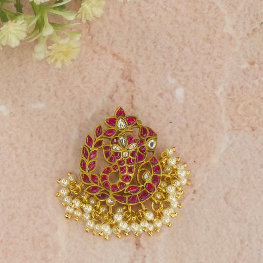 Here is Lord Ganesha pendant with pearls Covered with 22k gold plating. At the bottom of pendant we have pearls