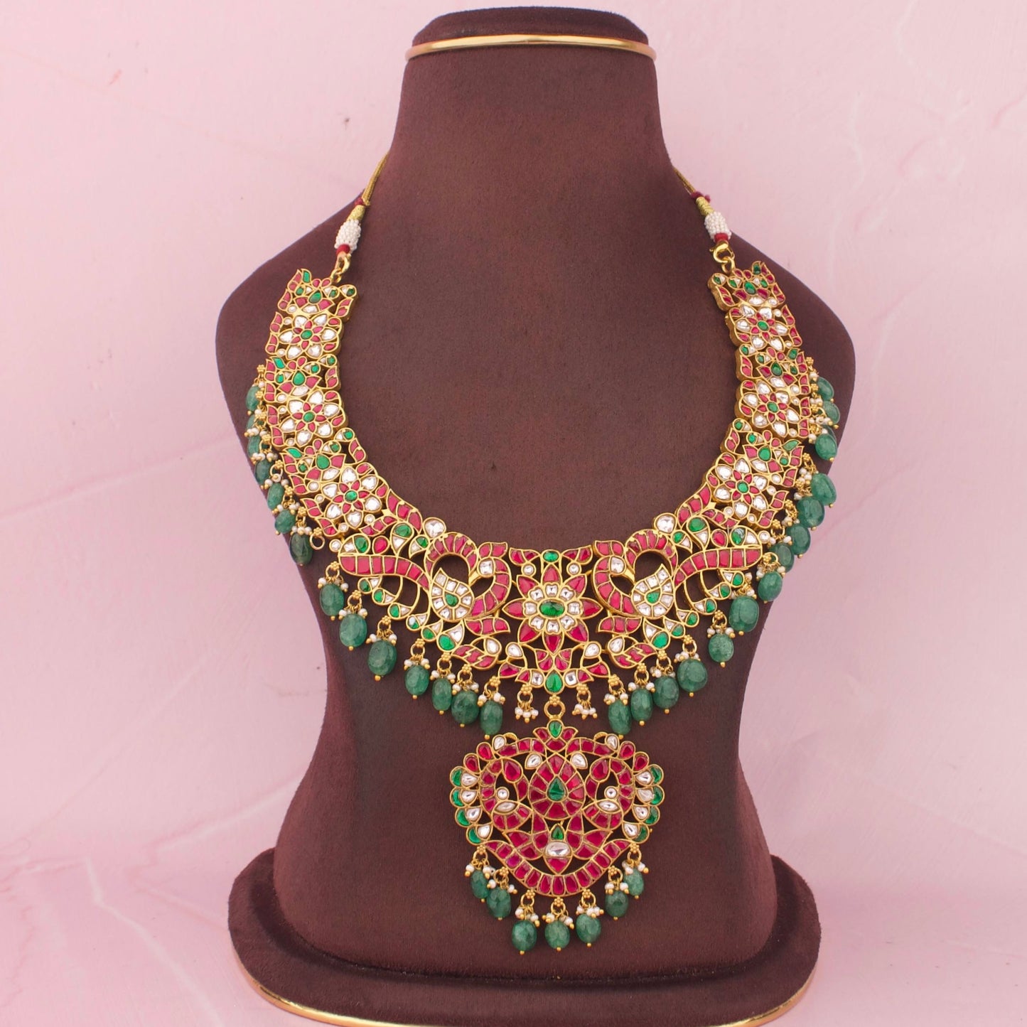 Premium Jadau Kundan Necklace With Ruby Stone Detailing, Emerald Bead Hanging And Floral Peacock Design With Pendant