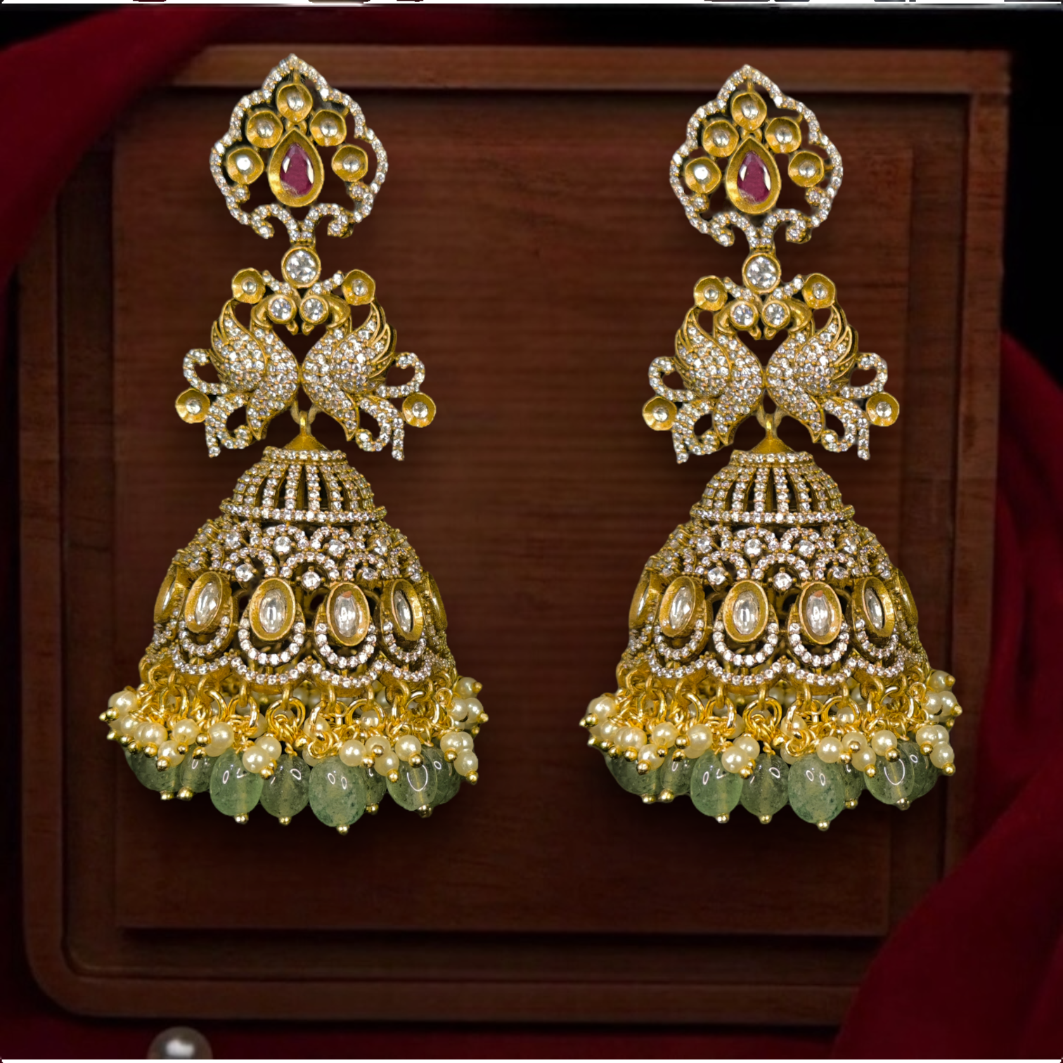 Victorian Peacock Jhumkas with zircon & pearls. This Victorian Jewellery is available in a Red colour variant. 