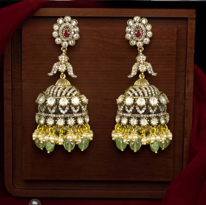 Diamond Look Victorian Jhumka with pearl accents. This Victorian Jewellery Is available in White, Red & Green colour varaiants. 
