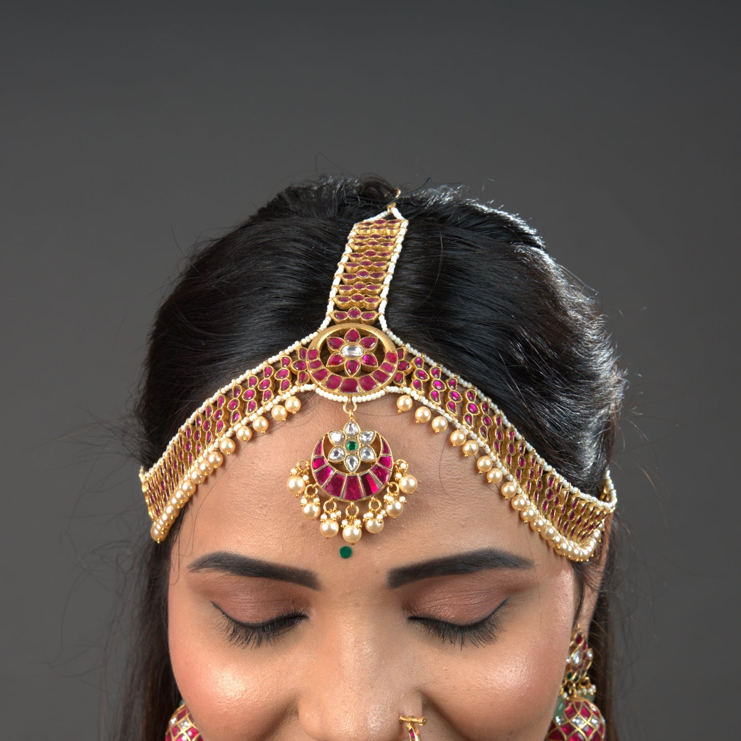 Regal Jadau Kundan Mathapatti with Ruby and Pearl Embellishments with 22k gold plating. this product comes under jadau kundn jewellery category