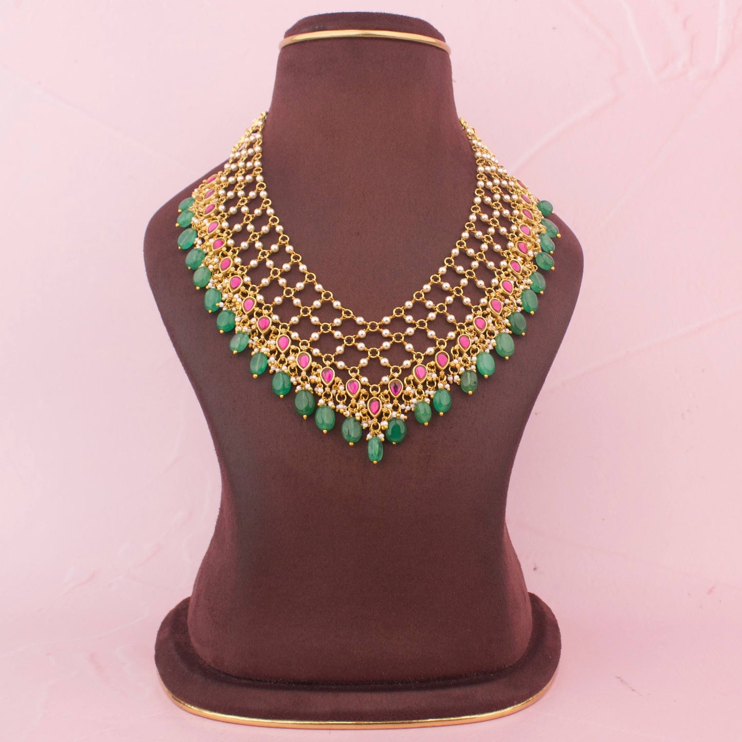 Gold Finish Jadau Kundan Necklace With Pearl Detailing And Emerald Green Hangings