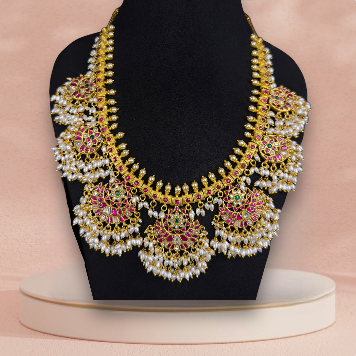 Opulent Guttapusulu Jadau Kundan Necklace with Pearl Tassels and Floral Accents with 22k gold platingThis product belongs to Jadau Kundan jewellery Category