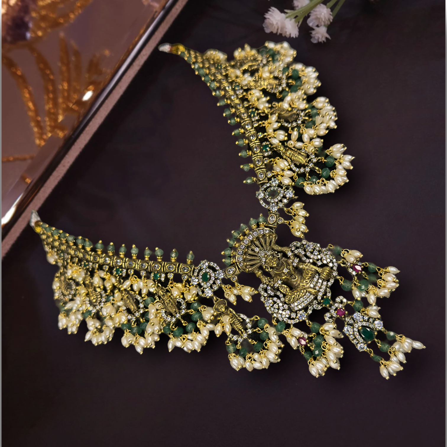 Beautiful Victorian Guttapusalu Necklace Set with earrings.  The jewellery is studded with zircon,God Motif,pearls, and beads. This Victorian Jewellery is available in a Green colour variant. 
