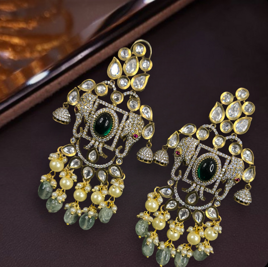 Victorian Kundan Polki Earrings with Elephant motifs, zircon stones & Fresh pearls. This Victorian Jewellery is available in a Green colour variant. 